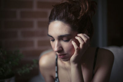 Close-up of thoughtful young woman
