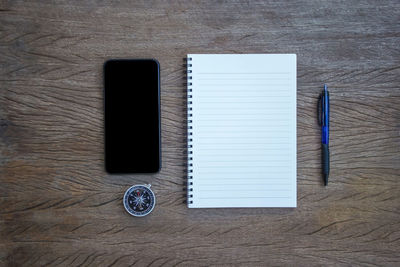 High angle view of smart phone on table