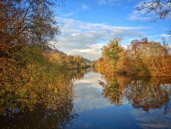 Scenic view of lake against sky during autumn