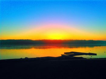 Silhouette of boats at sunset