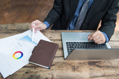 High angle view of man working on table