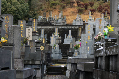 View of cemetery against built structures