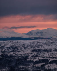 Scenic view of snowcapped mountains against romantic sky