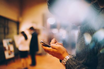 Close-up of woman using mobile phone