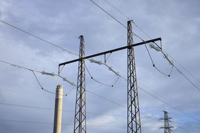 Low angle view of electricity pylon