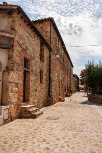 Alley amidst buildings in city