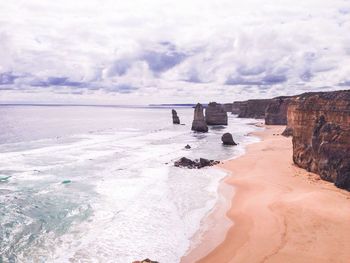 Scenic view of landscape against cloudy sky