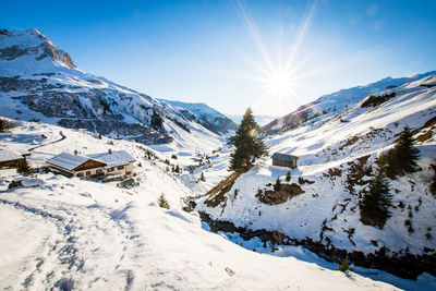 Scenic view of snow mountains against sky