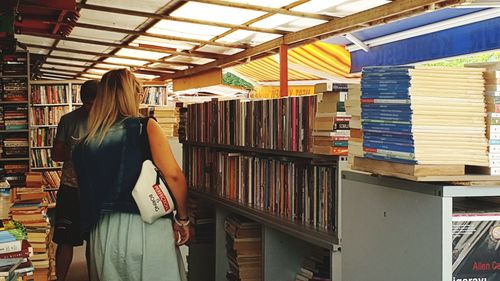 Rear view of woman reading book