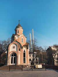 Low angle view of building against clear blue sky