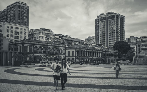 People walking on street in city