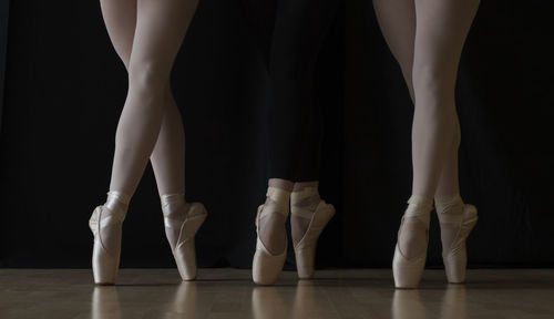 Low section of women dancing on floor