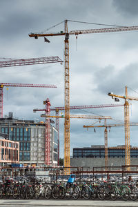 Low angle vies of several types of construction cranes used to rebuilt the whole city