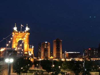 Illuminated buildings in city at night