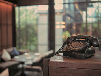 Close-up of clock on table