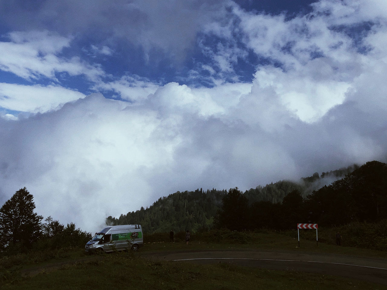 SCENIC VIEW OF ROAD AMIDST FIELD AGAINST SKY