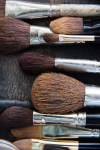 High angle view of make-up brushes on table