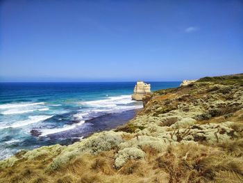 Scenic view of sea against blue sky