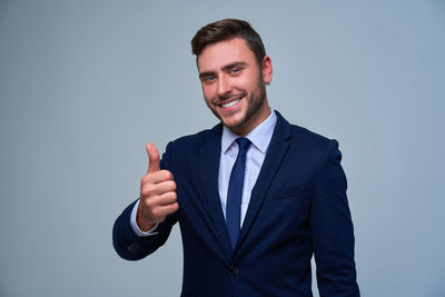 Portrait of young man against white background