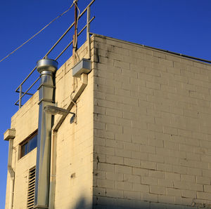 Low angle view of building against blue sky