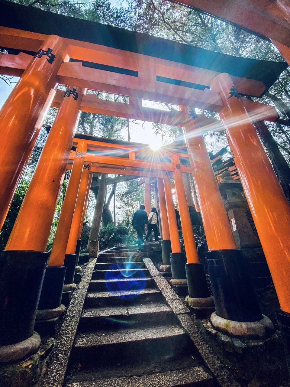 LOW ANGLE VIEW OF ILLUMINATED LIGHTS IN TEMPLE