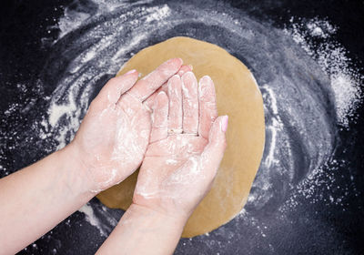 High angle view of hand holding hands