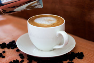 Close-up of coffee cup on table