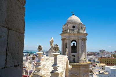 High section of cadiz cathedral against clear blue sky