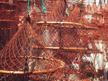 Close-up of fishing net in cage