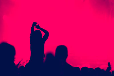 Silhouette people at music concert