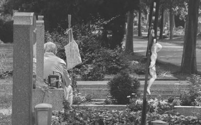 Rear view of woman against trees