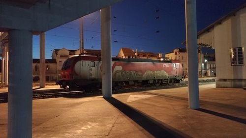 Train at railroad station against sky