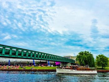 Boats in river with buildings in background