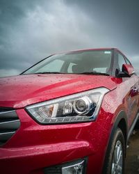 Red car against sky