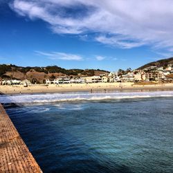 Scenic view of sea against cloudy sky