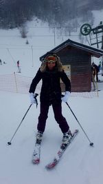 Man skiing on snow covered field