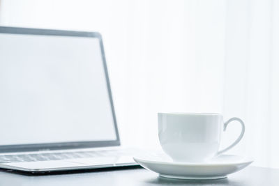 Coffee cup on table