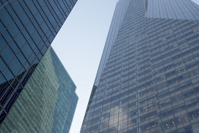 Low angle view of modern buildings against clear sky