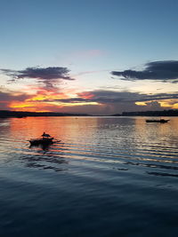 View of calm lake at sunset