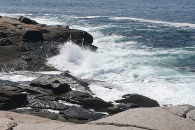 Waves splashing on rocks