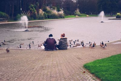 Reflection of people in water