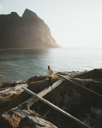 Man looking at sea against sky