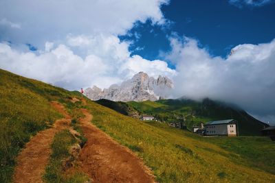 Scenic view of mountains against cloudy sky