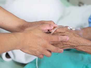 Close-up of man holding hands