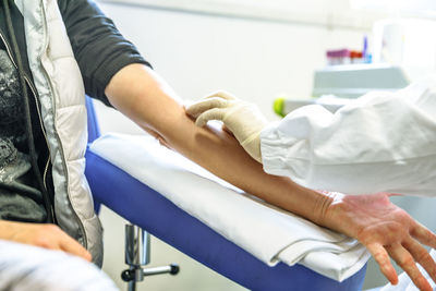 Doctor giving treatment to patient at hospital