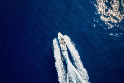 High angle view of sailboat sailing in sea