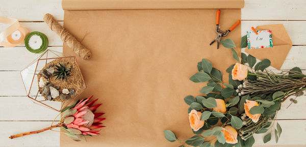 Close-up of potted plant on table against wall