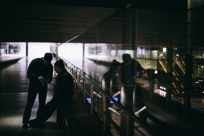 People walking on railroad station platform