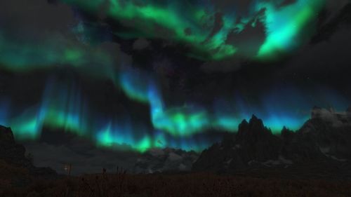 Scenic view of landscape against sky at night