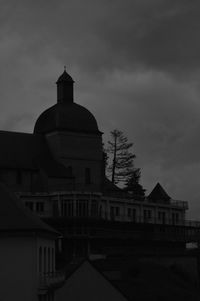 Low angle view of historic building against sky at dusk